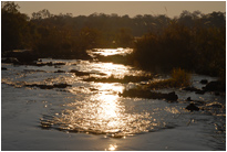 Sonnenaufgang an den Popa Falls, Namibia